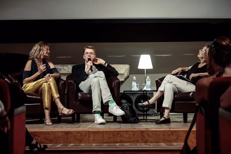 Festival di Spoleto panel discussion with three speakers on stage