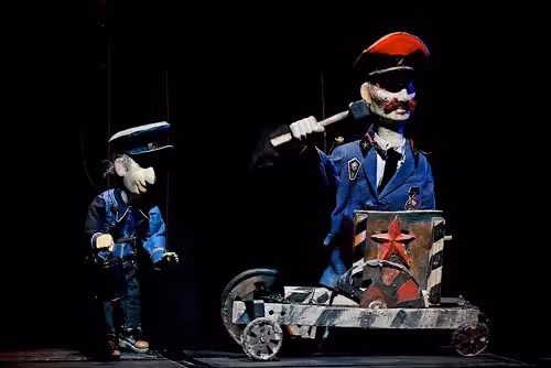 Theatrical performers at Festival di Spoleto with surreal marionette characters