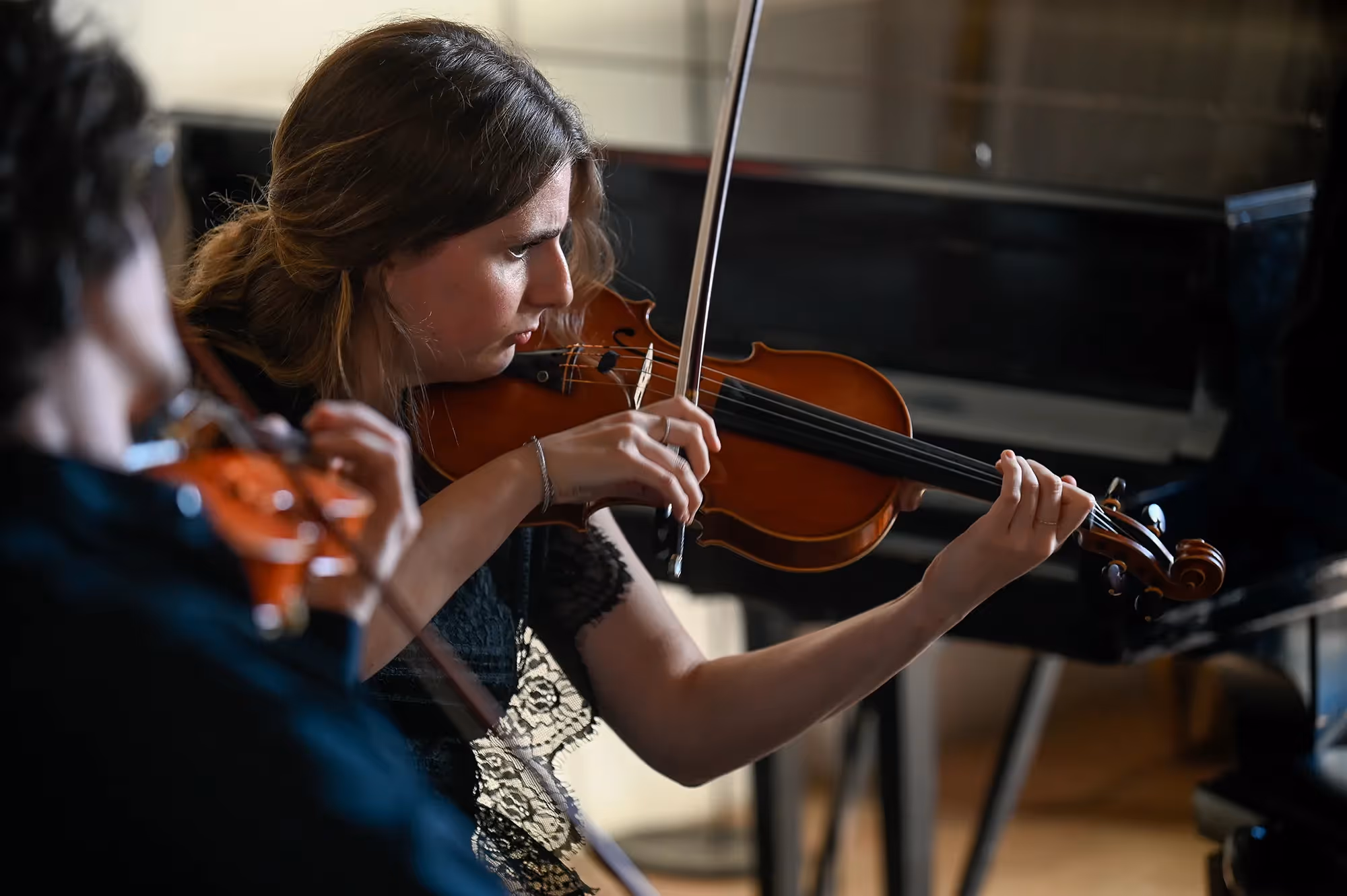 Violinists performing at Festival di Spoleto, showcasing classical music artistry