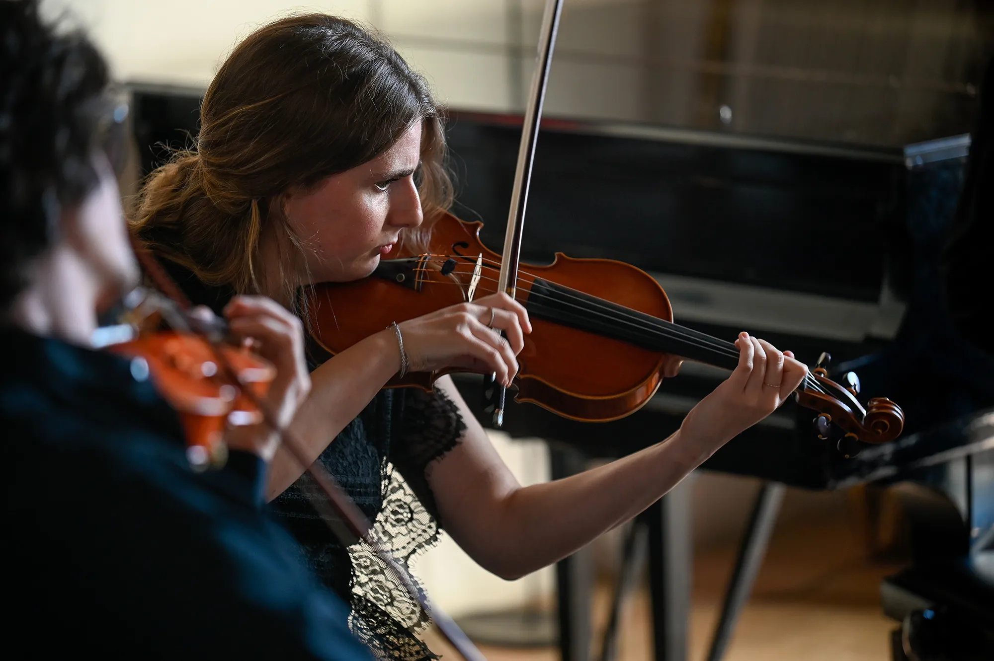 Violinists performing at Festival di Spoleto, showcasing classical music artistry