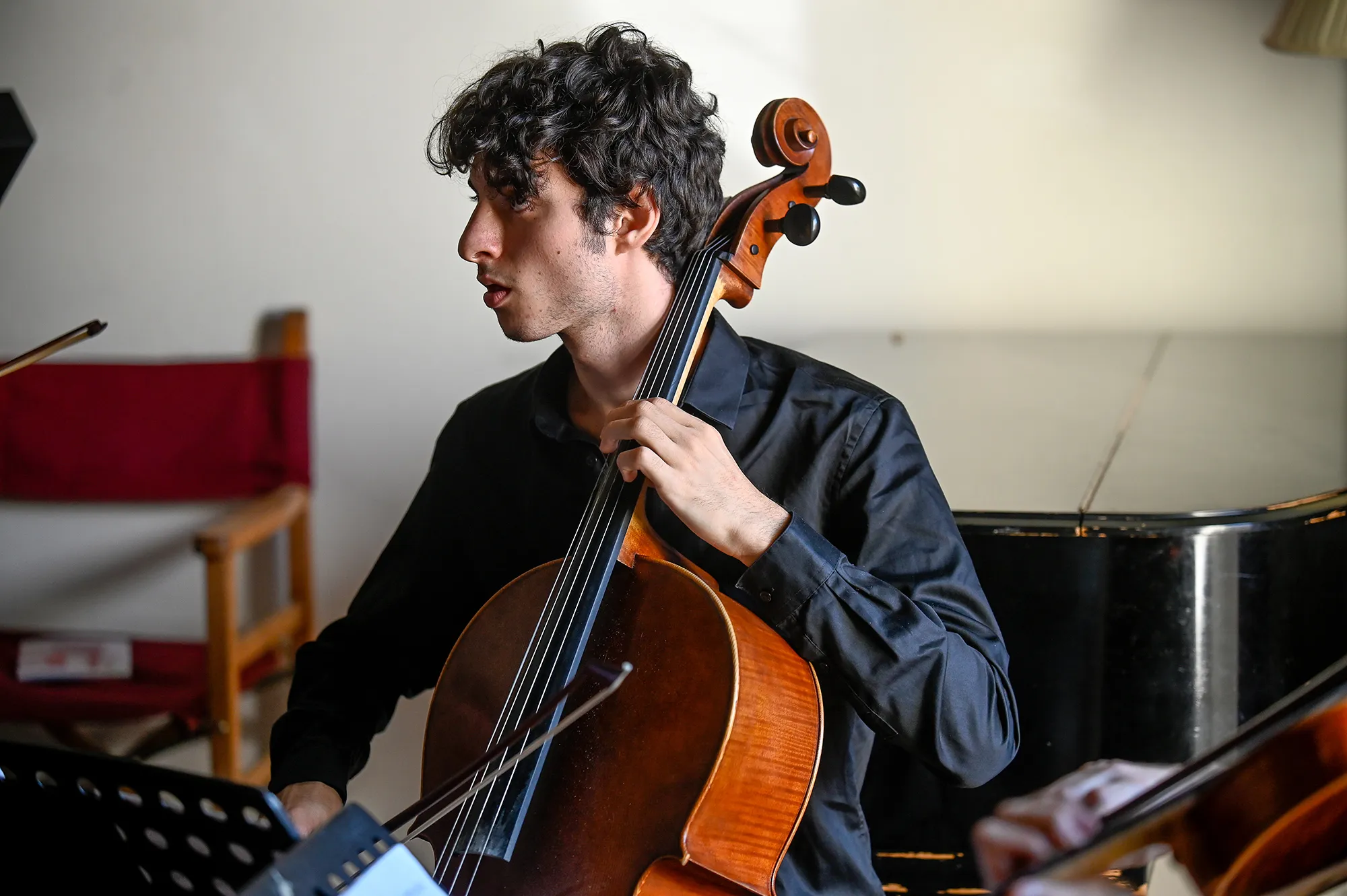 Cellist performing at Festival di Spoleto, wearing black shirt