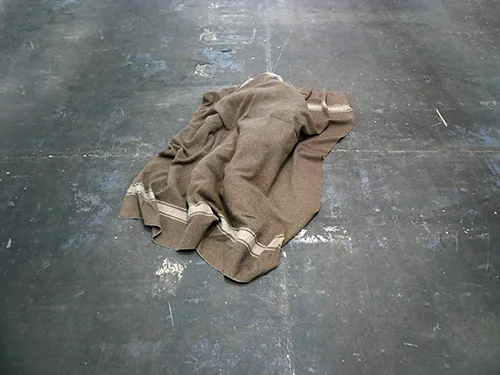 Crumpled brown textile on concrete floor at Festival di Spoleto