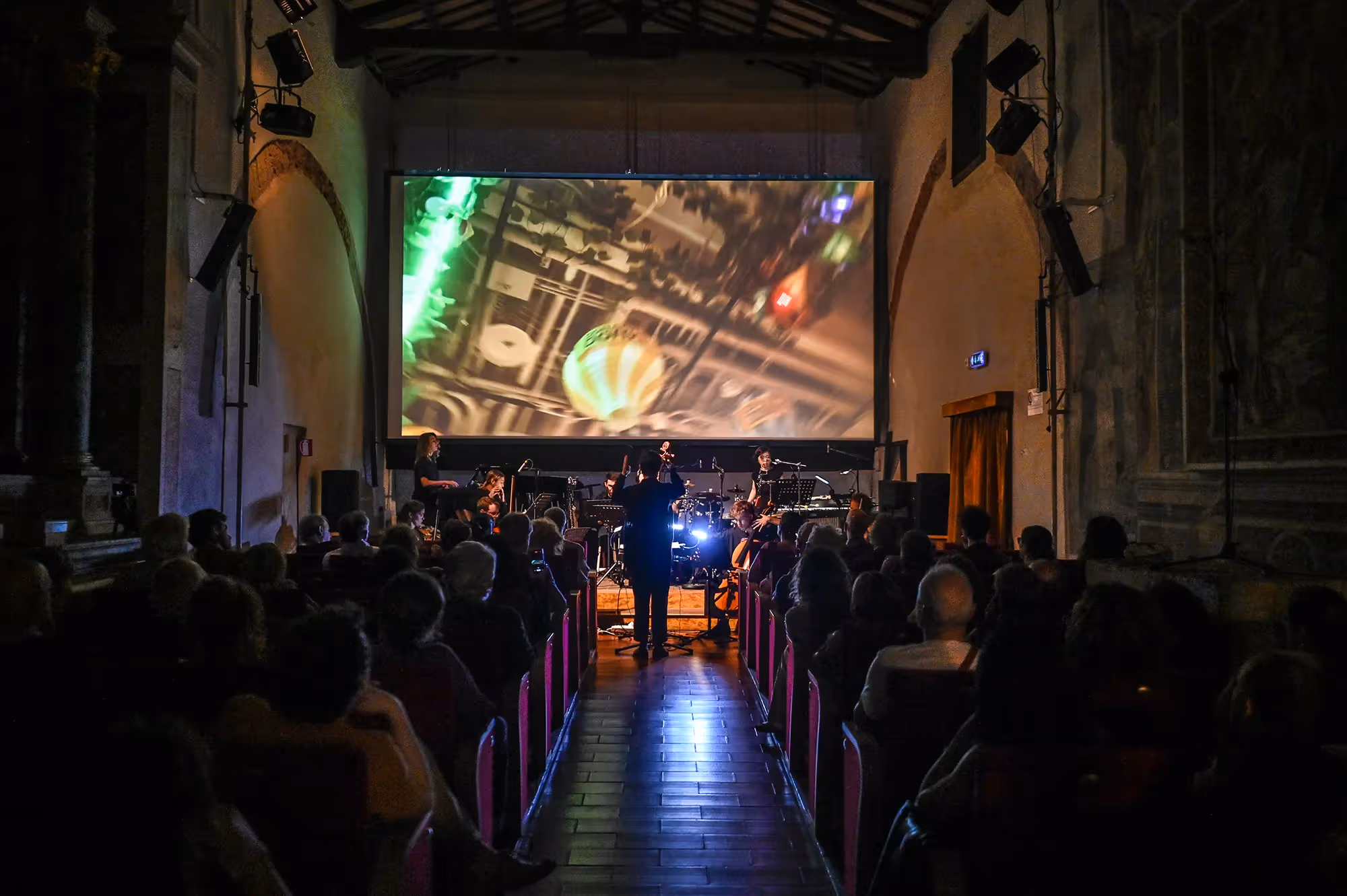 Festival di Spoleto performance with musicians and abstract projection in historic venue