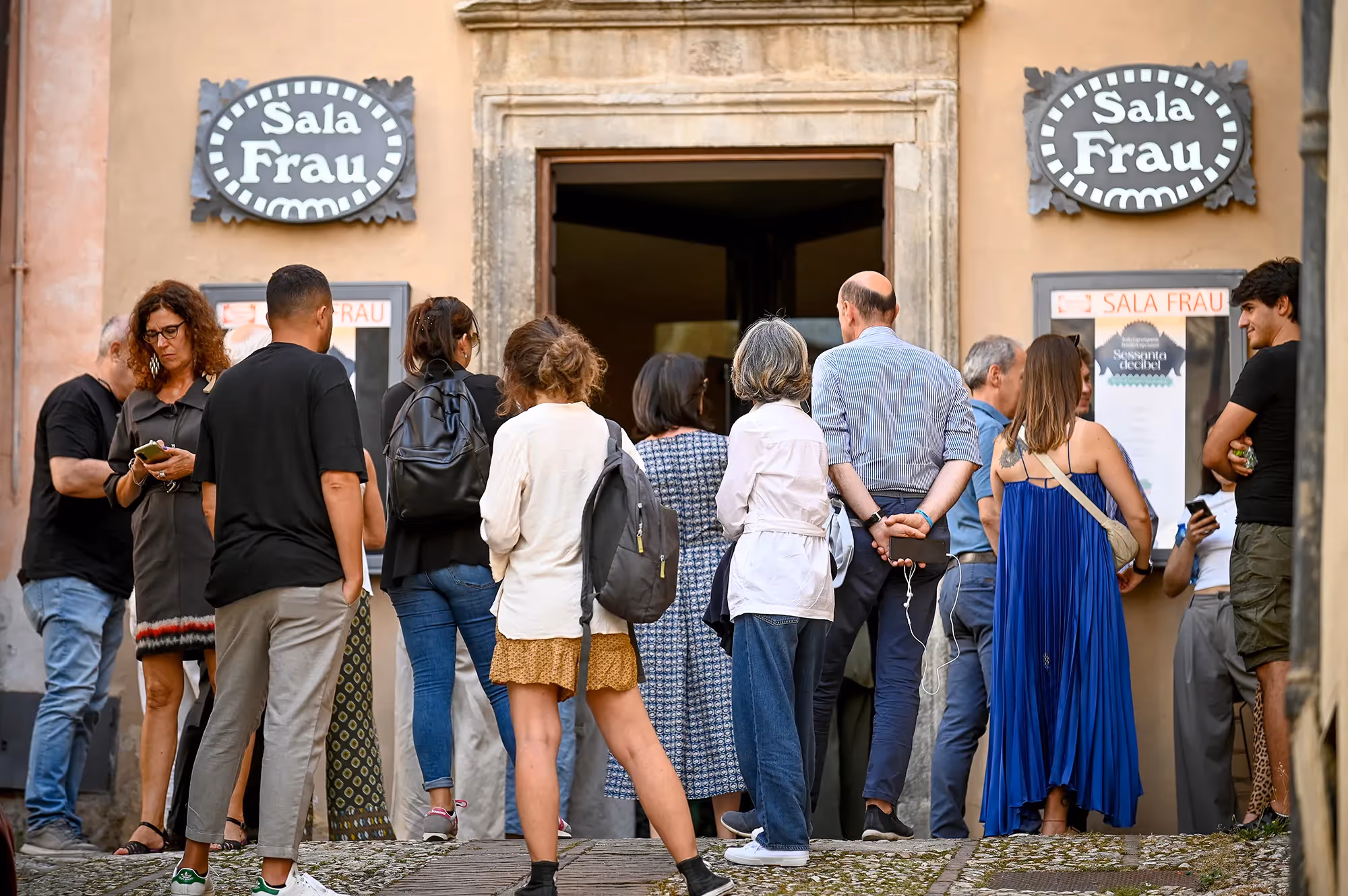Diverse crowd gathered outside Sala Frau during Festival di Spoleto