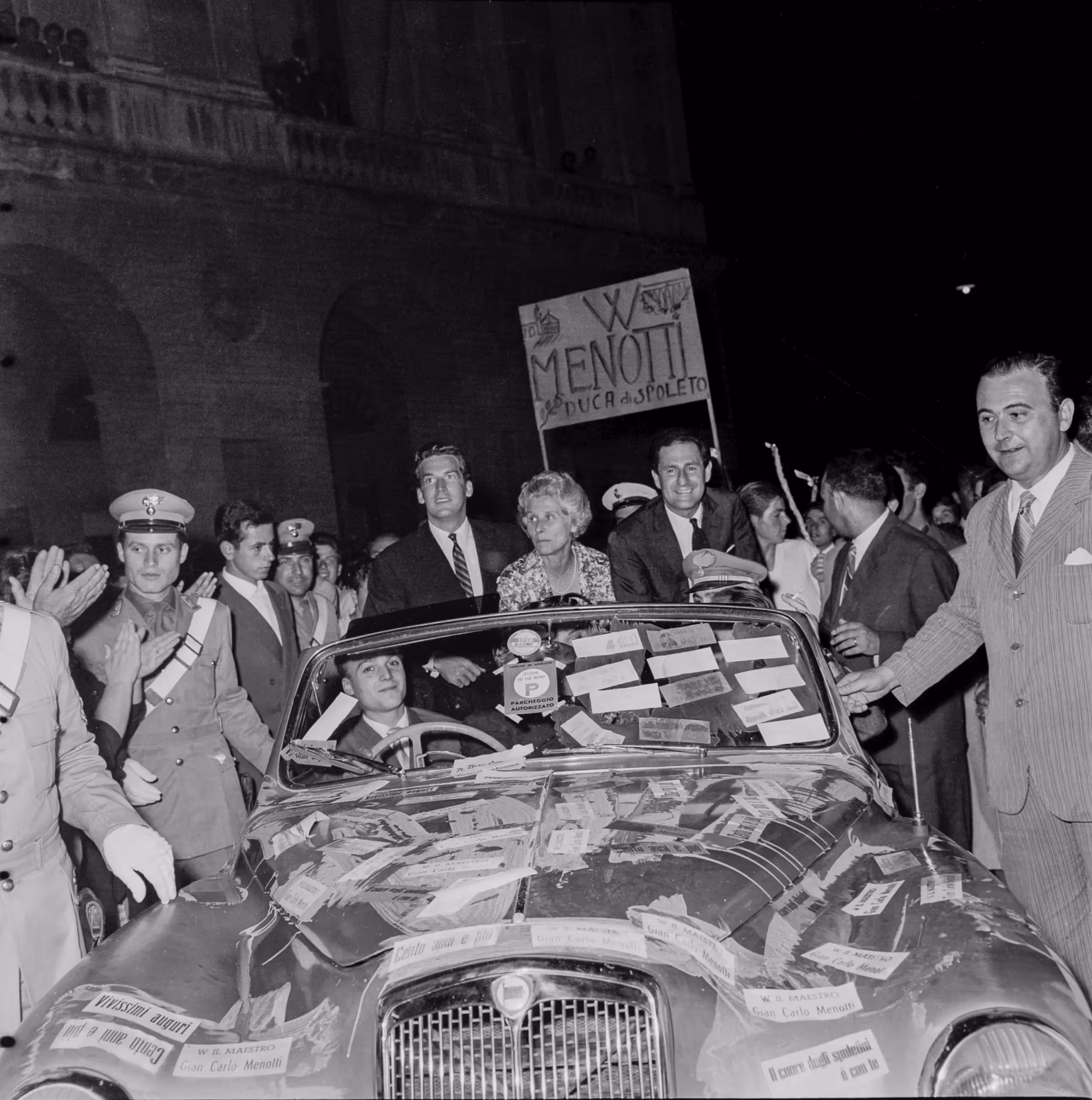 Festival di Spoleto crowd celebrates with decorated car and enthusiastic supporters