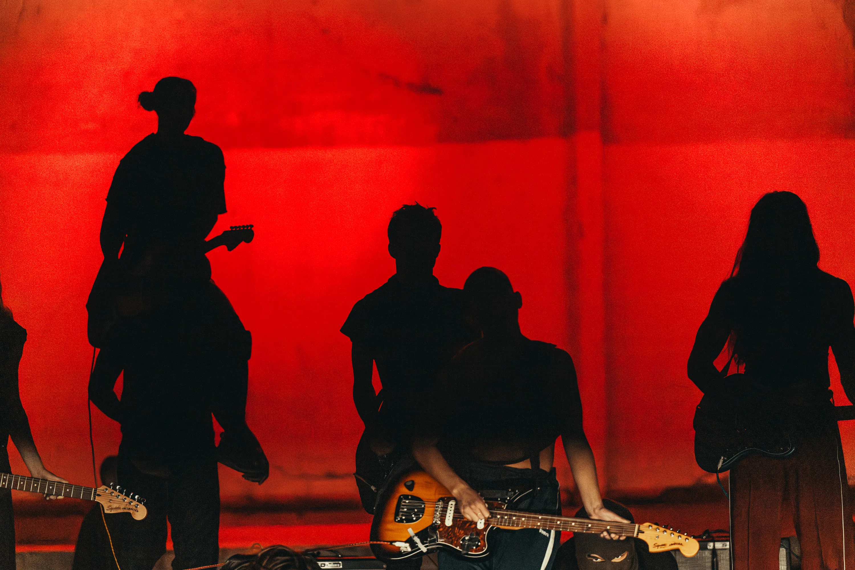 Festival di Spoleto musicians performing with vibrant red stage backdrop