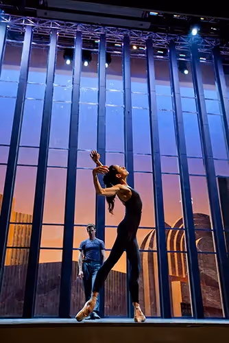 Dancer leaps dramatically at Festival di Spoleto with sunset backdrop