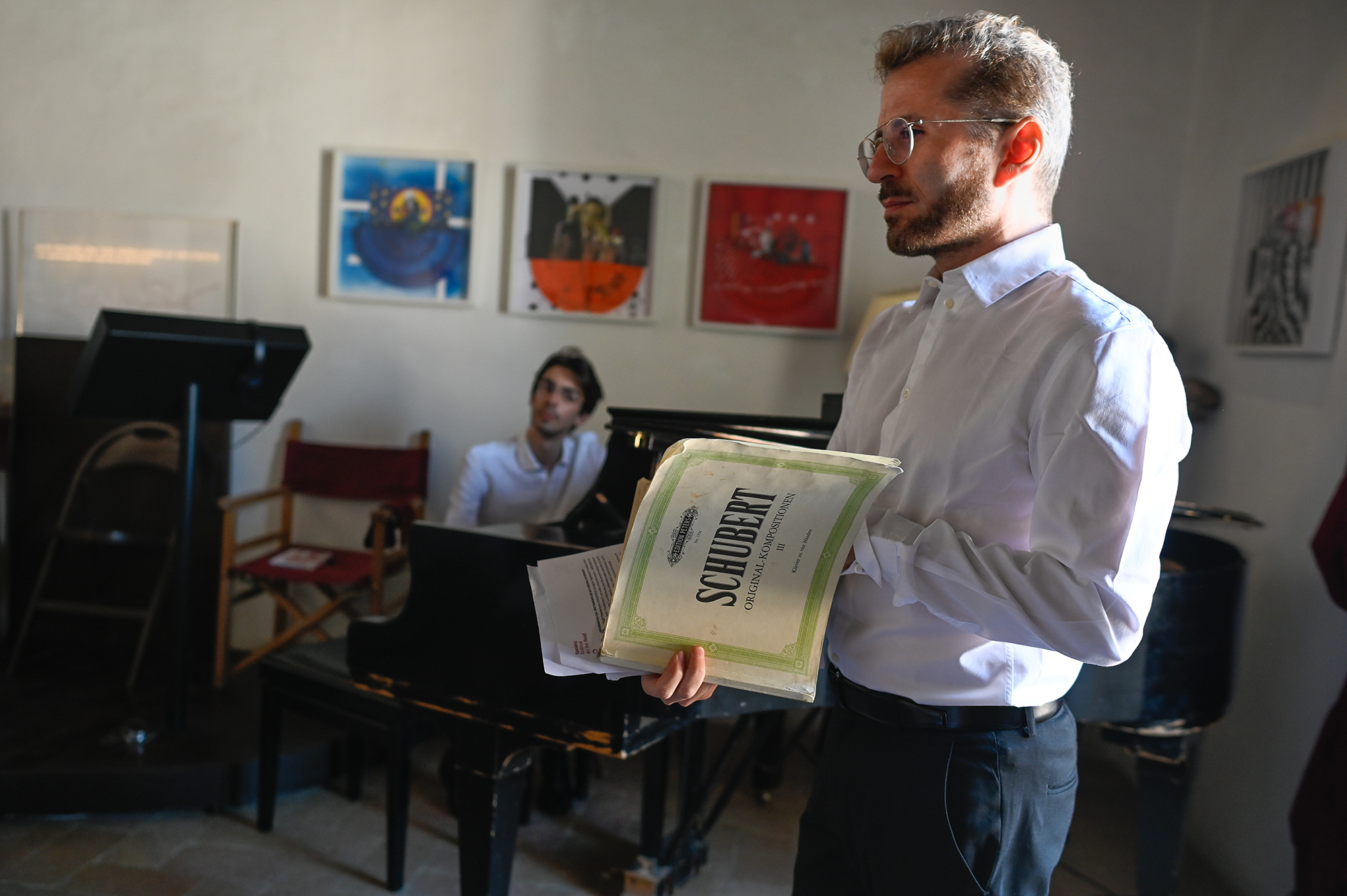 Festival di Spoleto staff reviewing art and performance documents in gallery