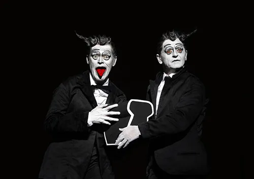 Theatrical performers at Festival di Spoleto in dramatic black and white makeup