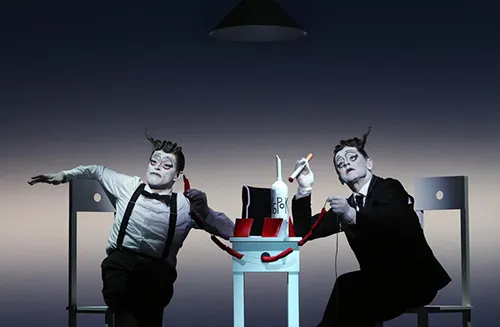 Mime performers at Festival di Spoleto showcase theatrical performance with surreal table