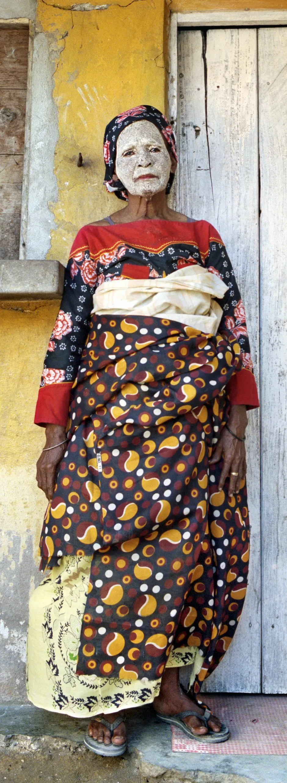 Elderly woman in vibrant patterns at Festival di Spoleto cultural event