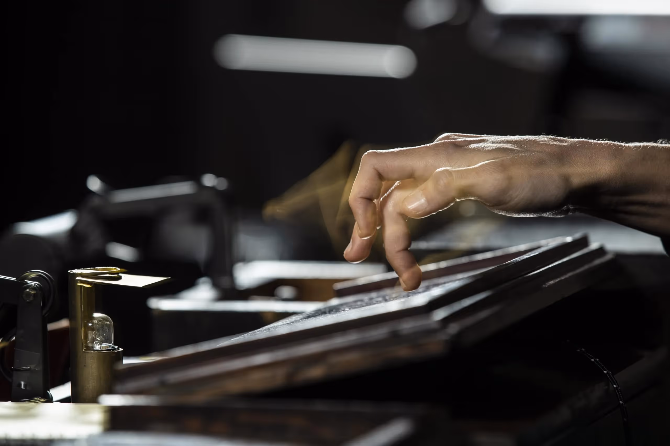 Hand playing piano at Festival di Spoleto, capturing musical performance
