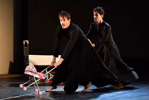 Dramatic performers with stroller on stage at Festival di Spoleto theater performance