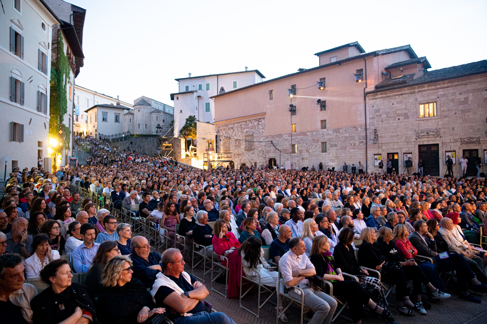 Large crowd gathered at Festival di Spoleto in historic Italian town square