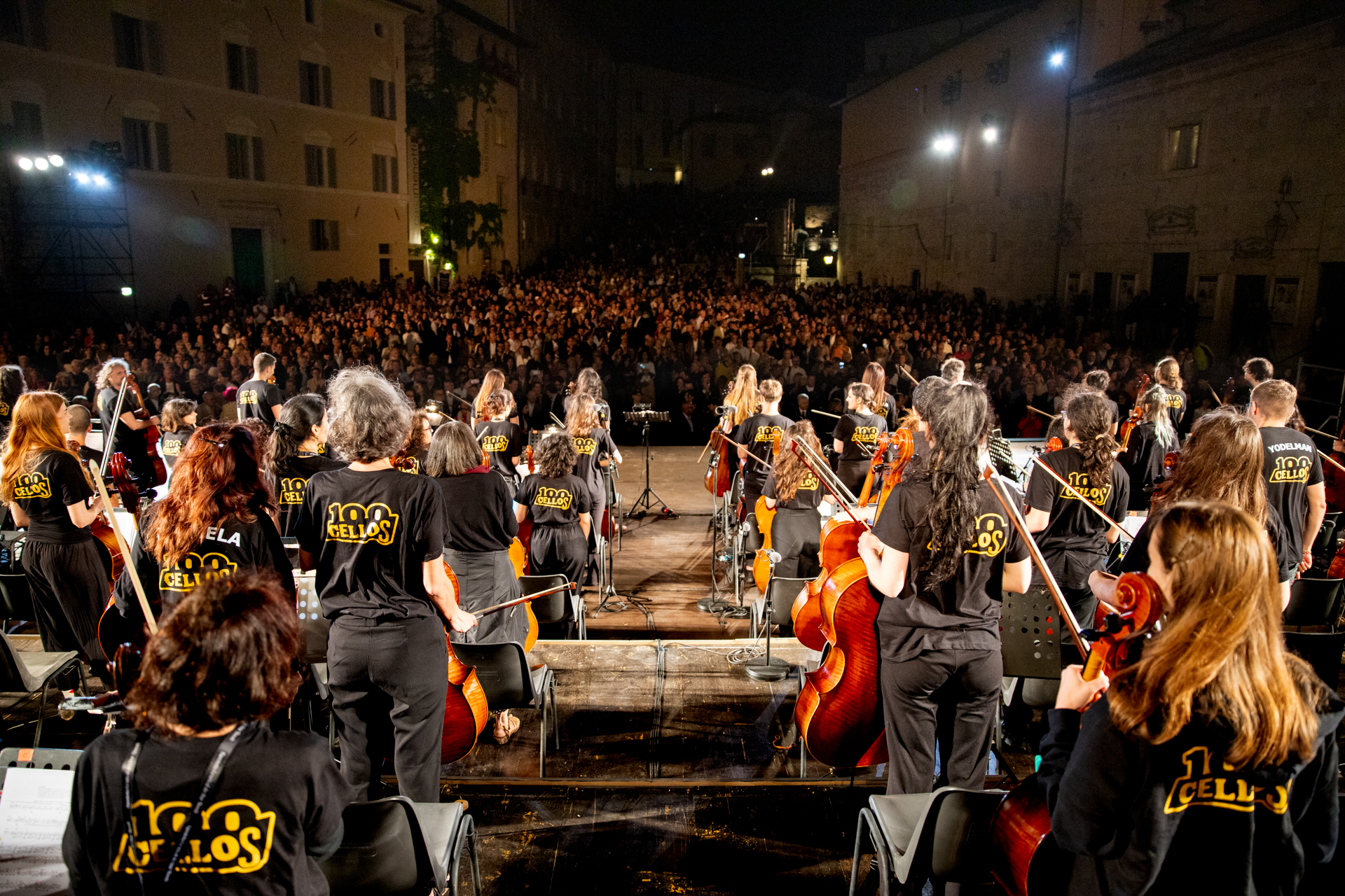 Festival di Spoleto orchestra performance with hundreds of cellists at night