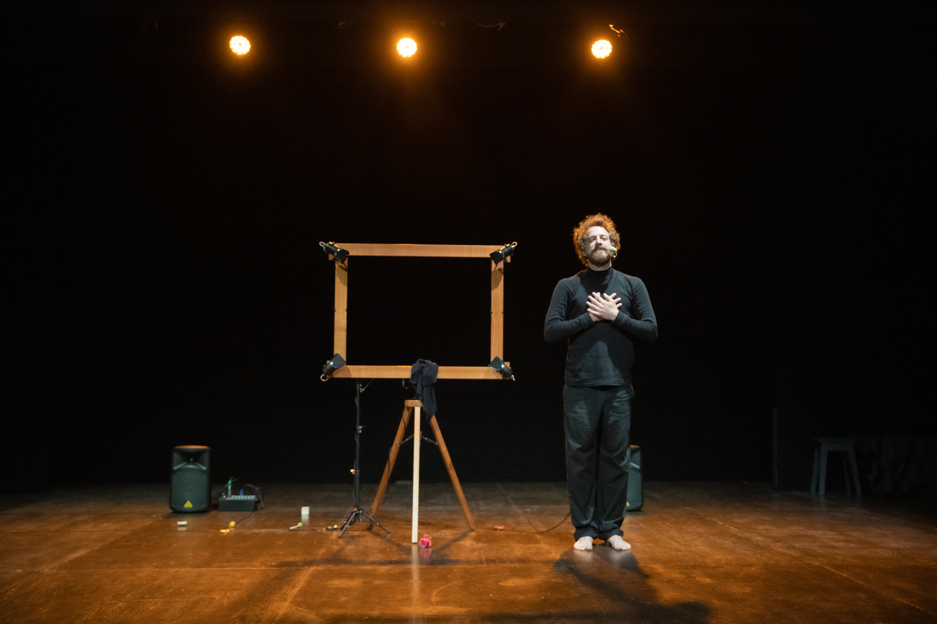 Festival di Spoleto performance with performer on stage near empty wooden frame
