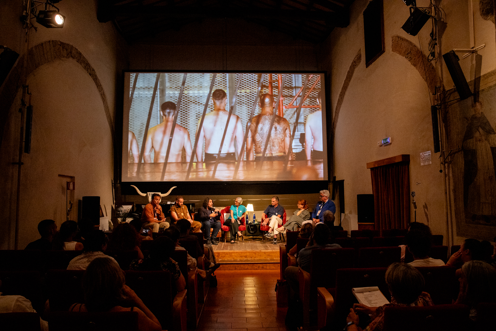 Festival di Spoleto panel discussion with artistic film projection in historic venue