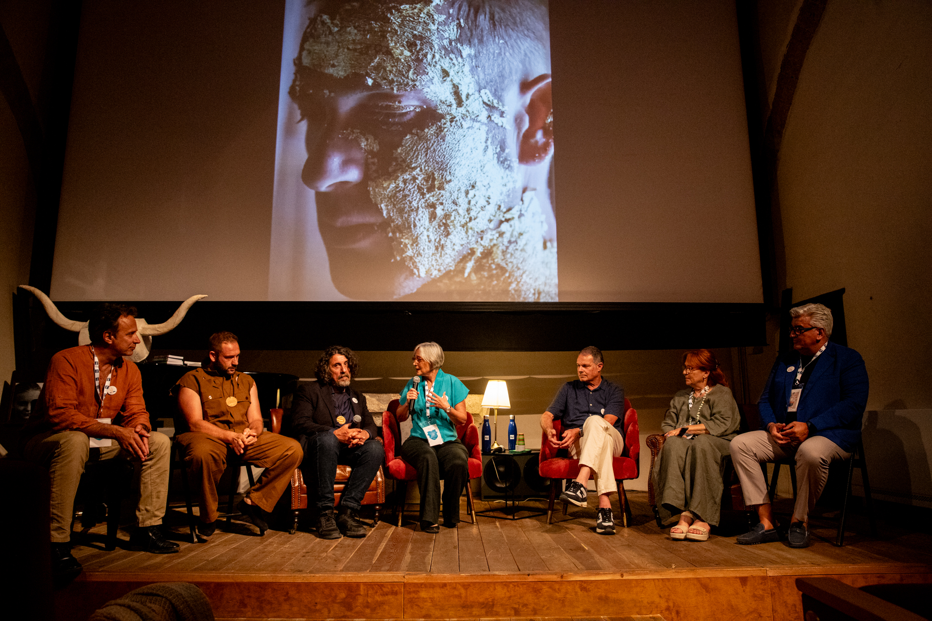 Festival di Spoleto panel discussion with artistic backdrop and diverse speakers