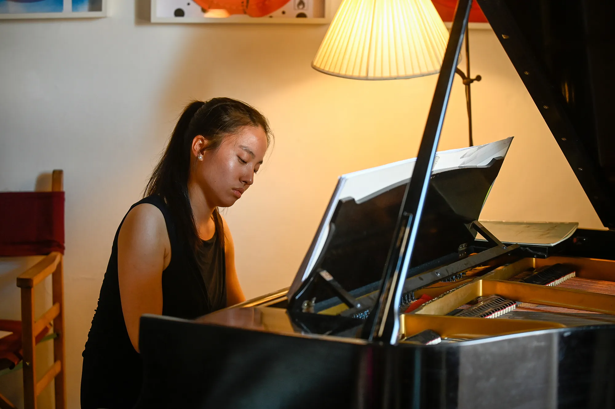 Pianist practicing for Festival di Spoleto under warm ambient lighting