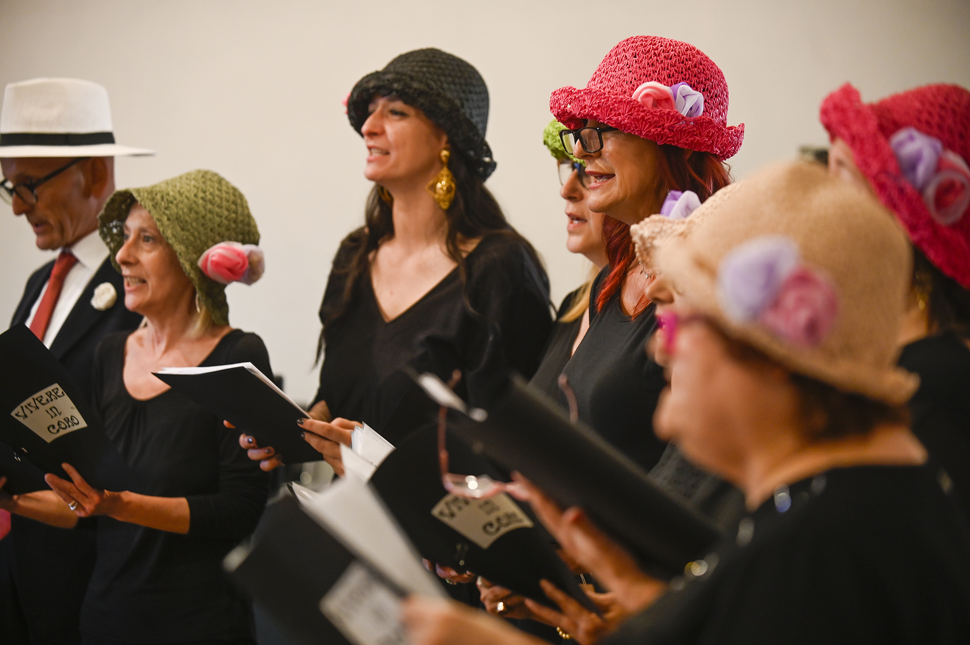 Singers in colorful hats performing at Festival di Spoleto cultural event