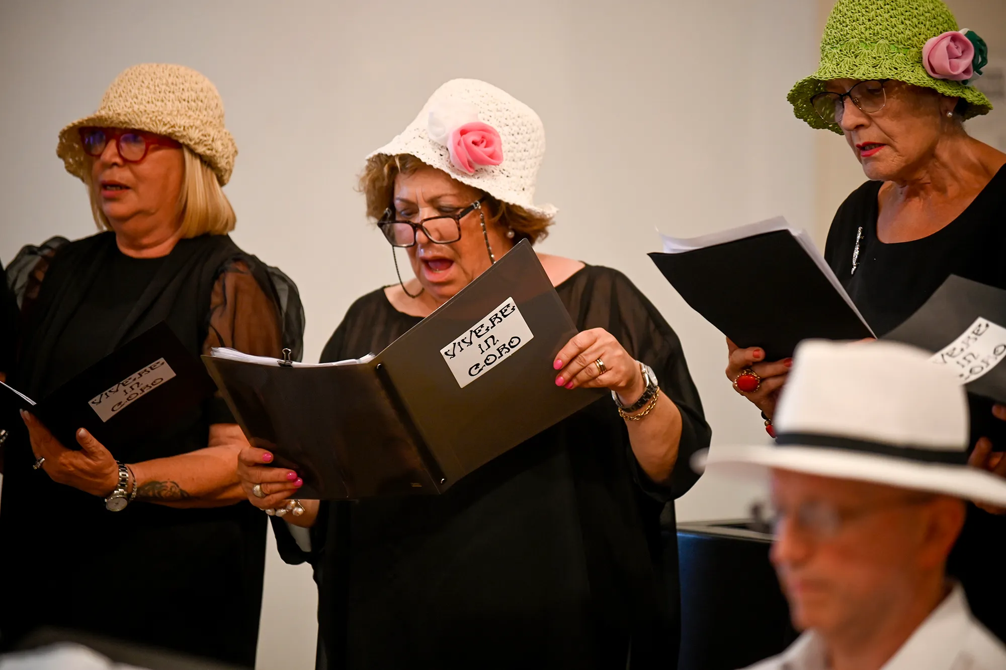 Choir performers in decorative hats at Festival di Spoleto cultural event