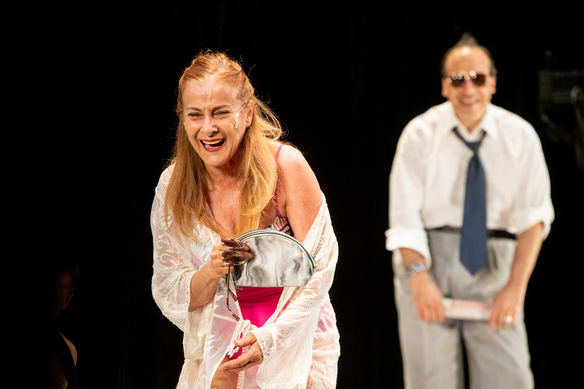 Actors performing theatrical scene at Festival di Spoleto, laughing dramatically