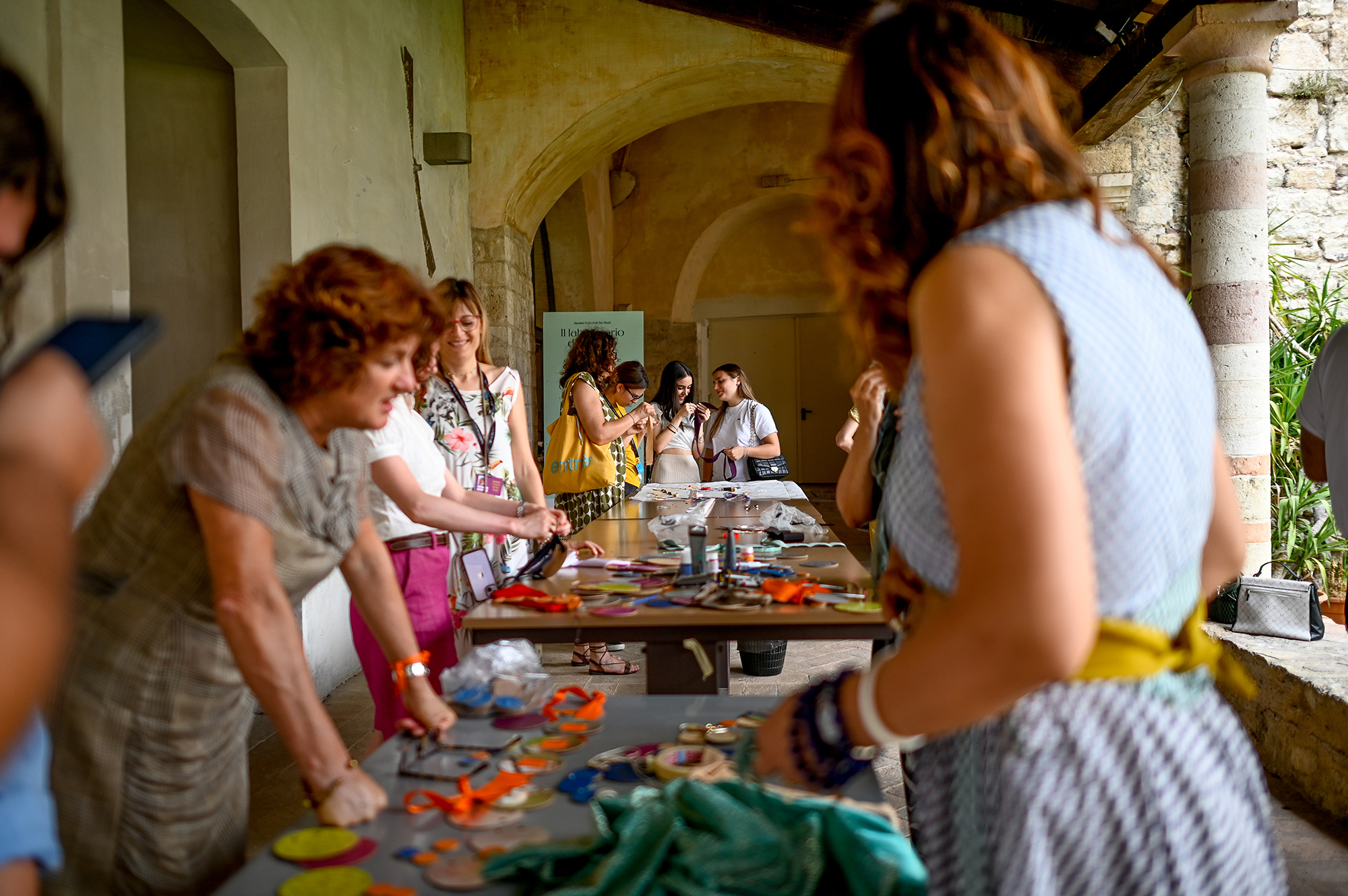 Festival di Spoleto workshop with women creating colorful crafts together