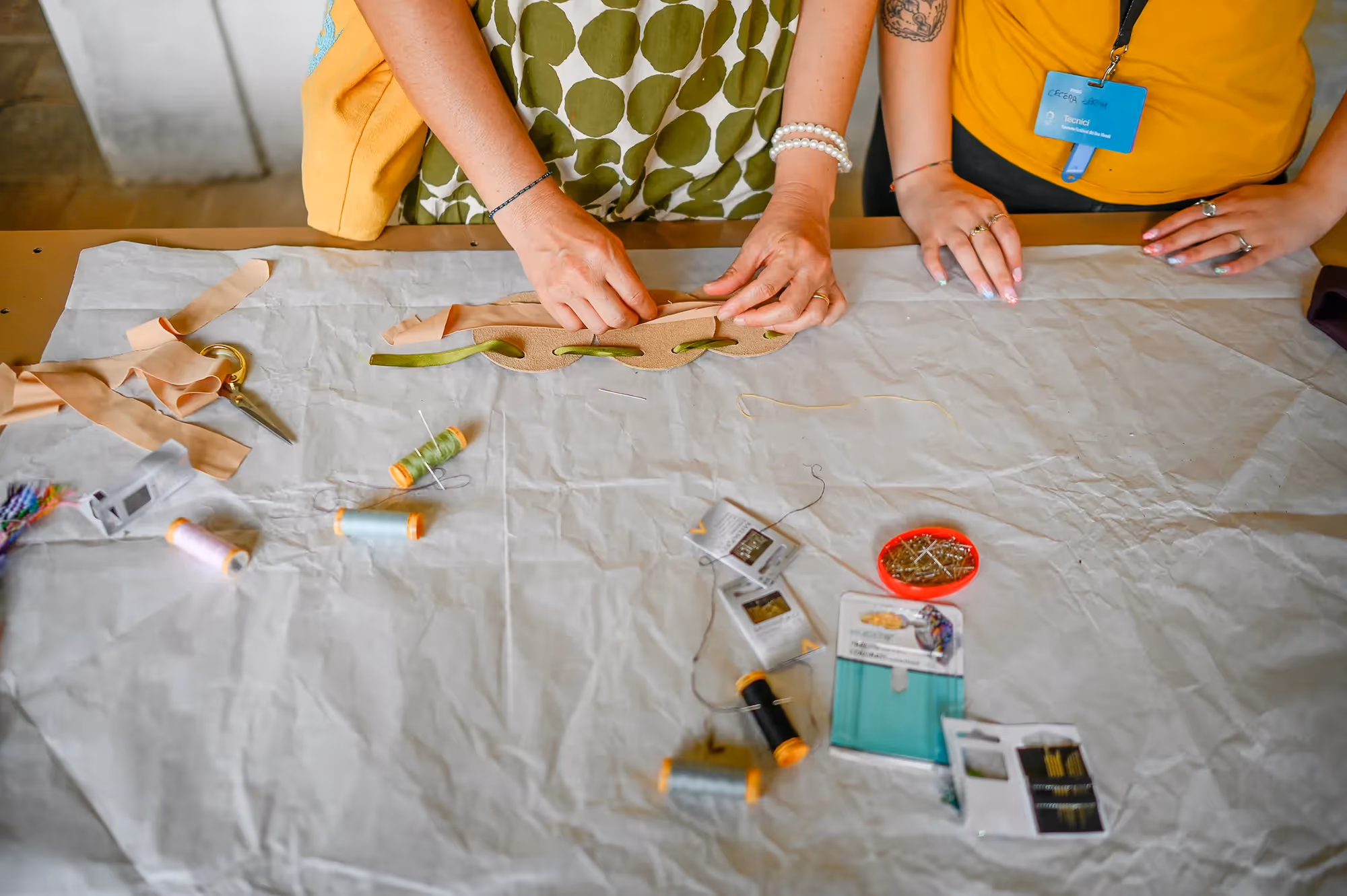 Festival di Spoleto artisan workshop with hands crafting leather accessory