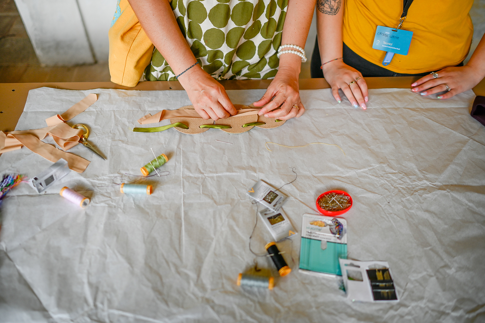 Festival di Spoleto artisan workshop with hands crafting leather accessory