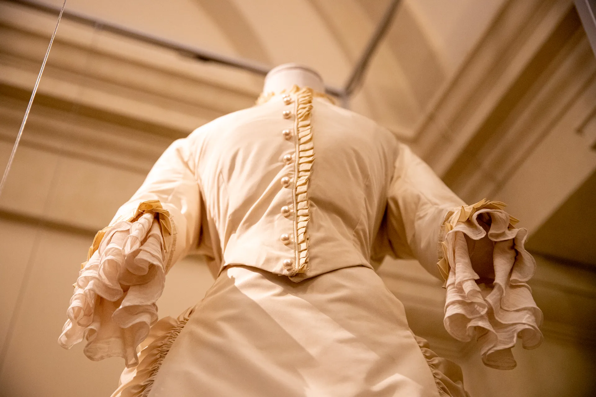 Detailed vintage dress at Festival di Spoleto exhibition, showcasing elegant craftsmanship