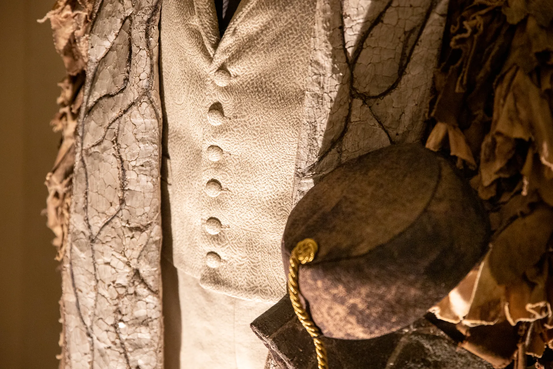 Vintage costume detail from Festival di Spoleto, textured fabric with golden button