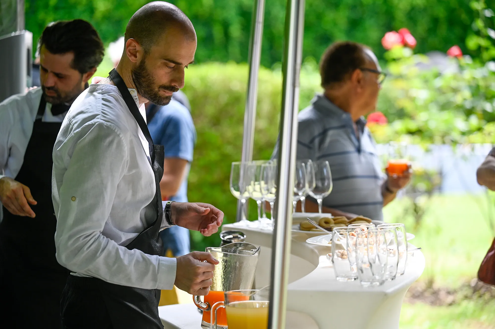 Bartender preparing drinks at Festival di Spoleto culinary event outdoors