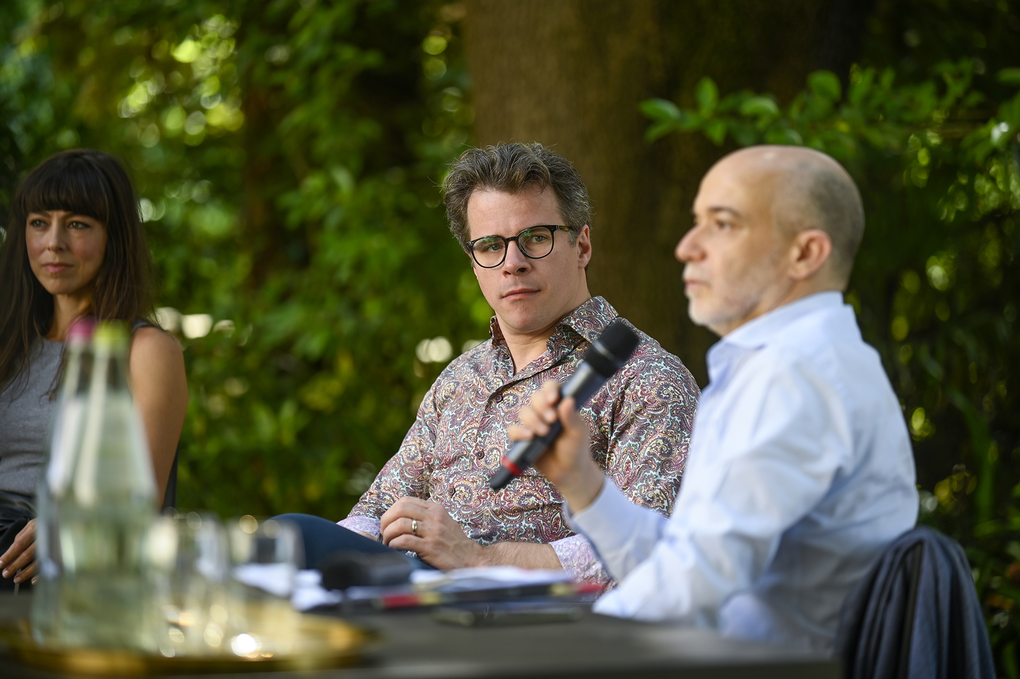 Festival di Spoleto press conference with three professionals outdoors