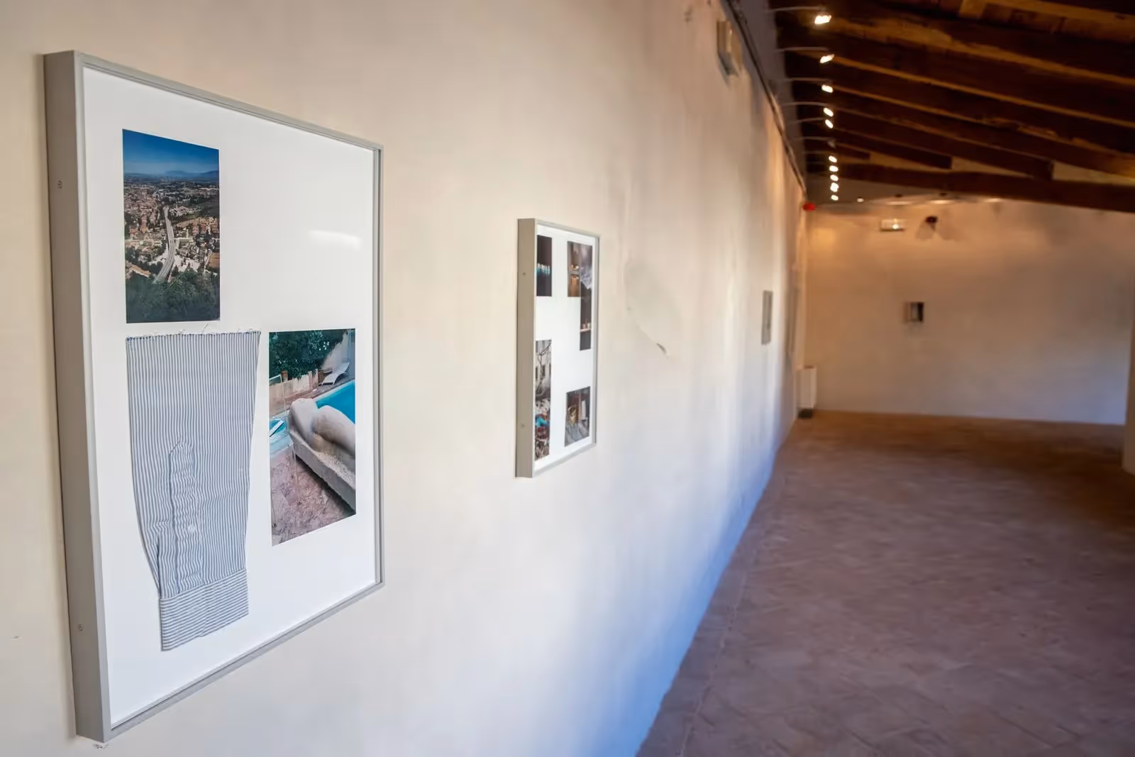 Framed photographs on gallery wall during Festival di Spoleto exhibition