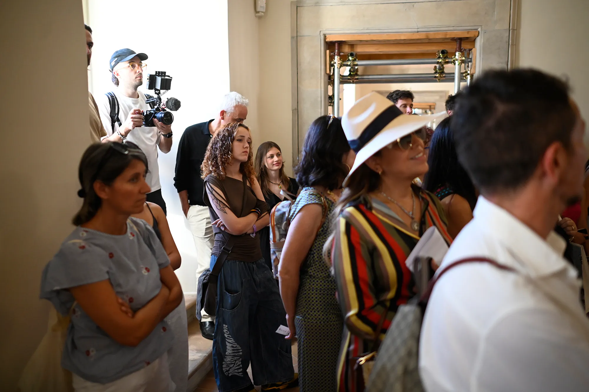 Festival di Spoleto backstage, diverse people gathered with camera operator