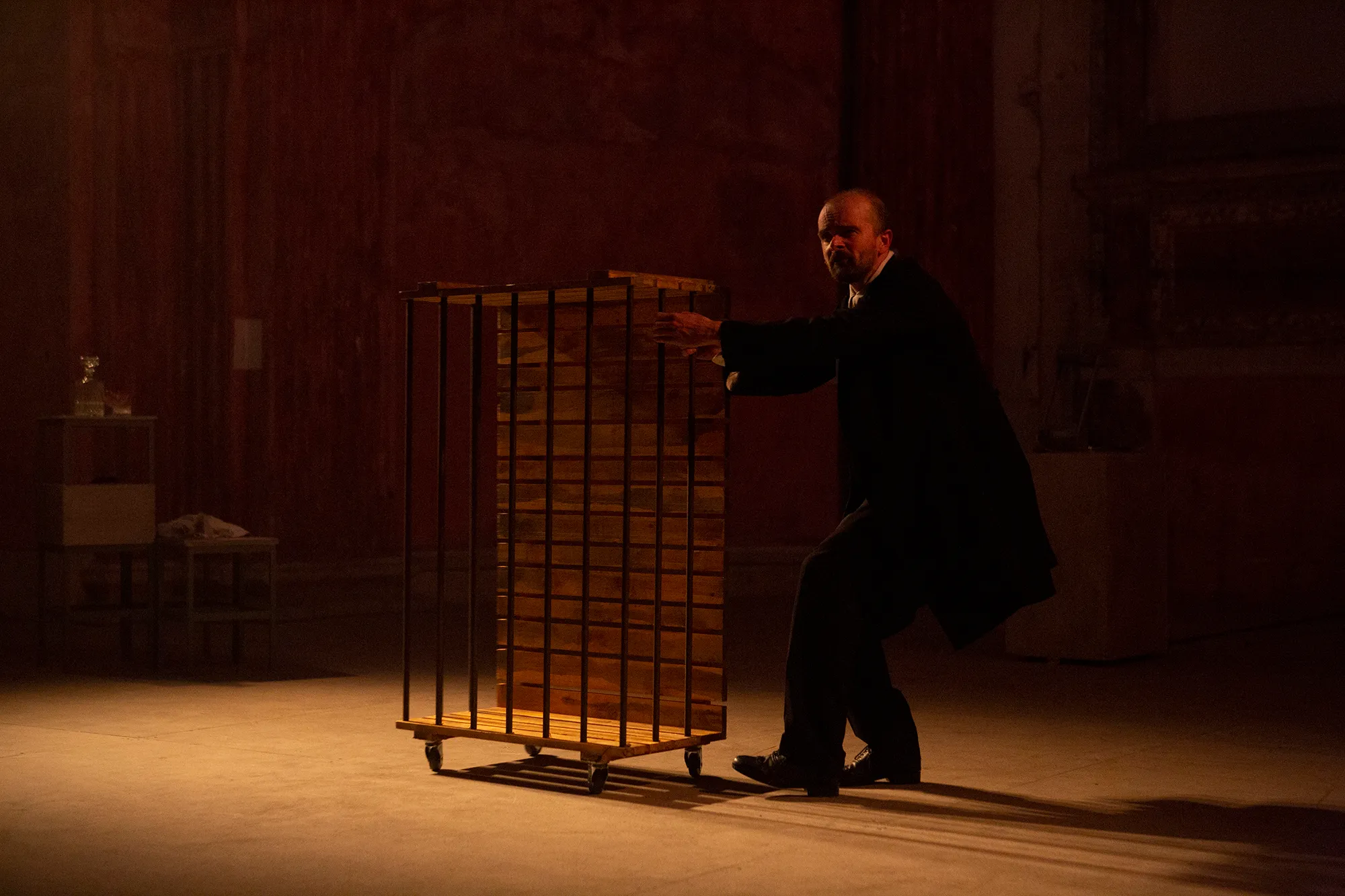 Dramatic performance at Festival di Spoleto with actor and cage-like structure