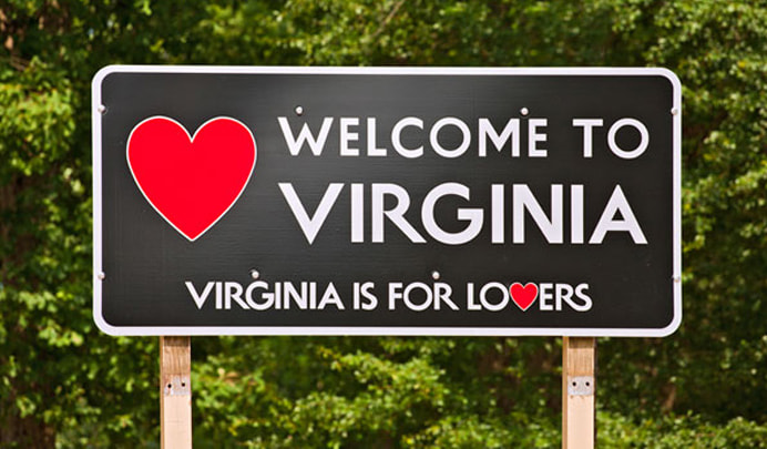 Virginia Is for Lovers welcome sign along the highway, used to represent licensure and expanding a therapy practice to Virginia