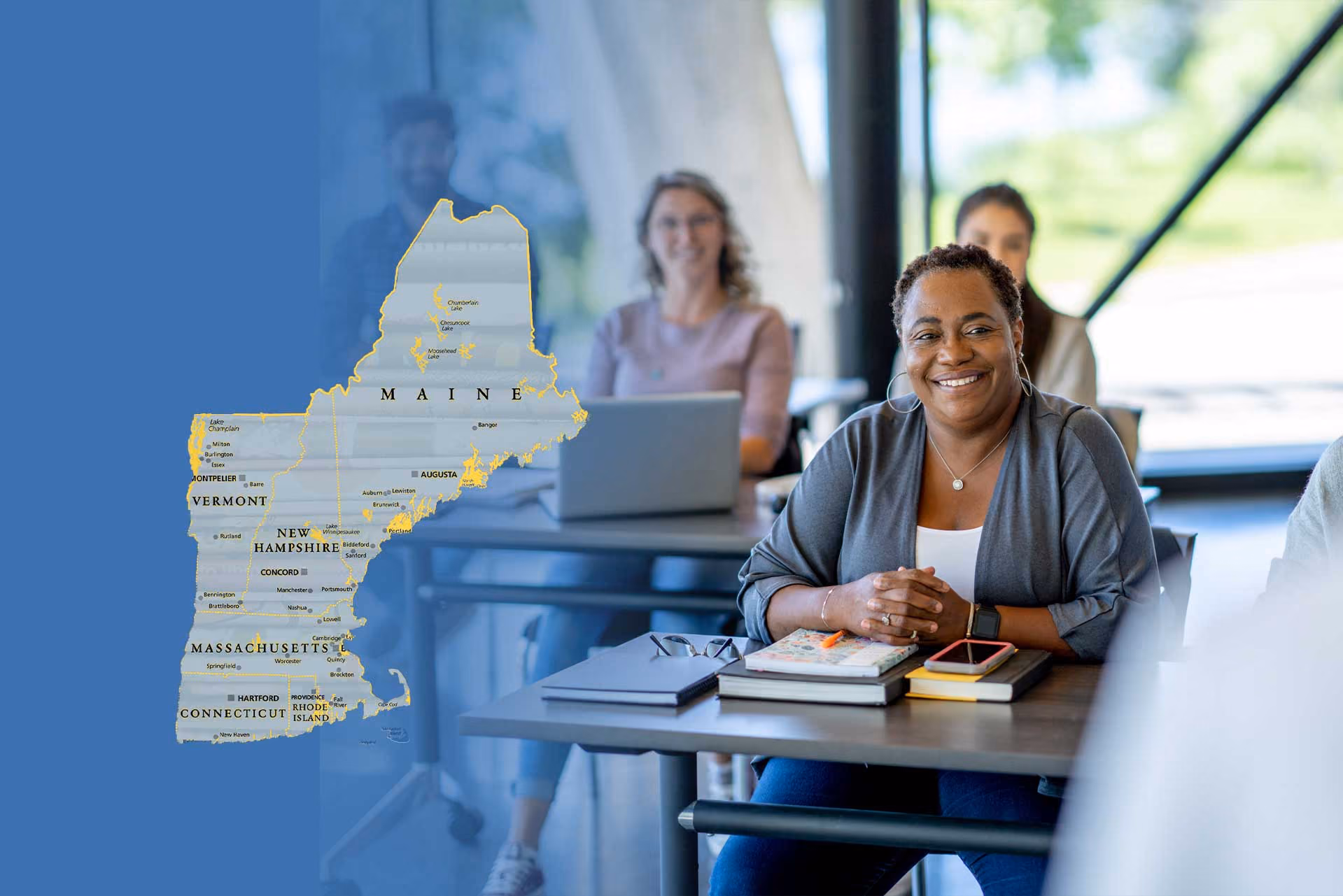 Smiling professional with New England map in modern office workspace