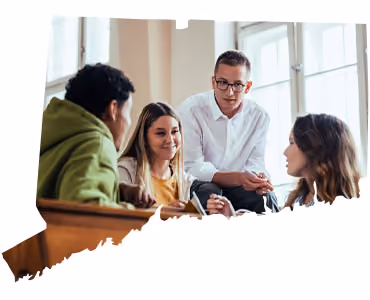 Diverse team collaborating in bright office during business meeting