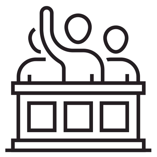 Jury or panel of people sitting behind a bench, raising hands