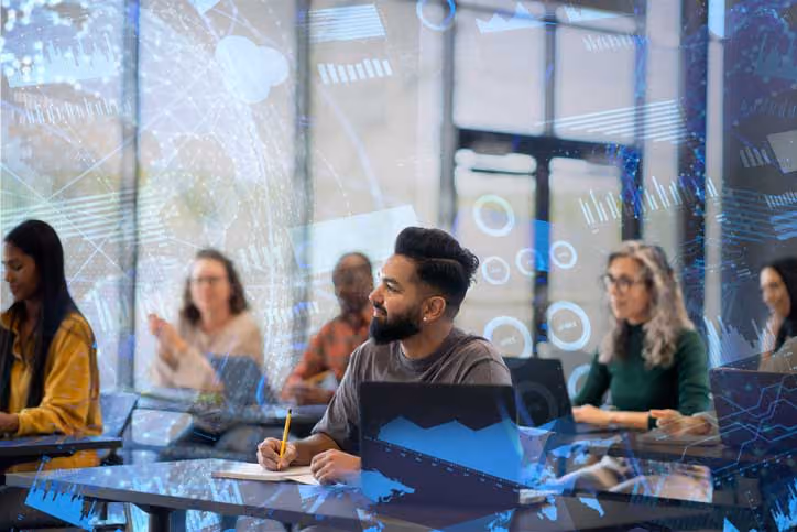 Diverse team in modern office with digital overlay, working and taking notes