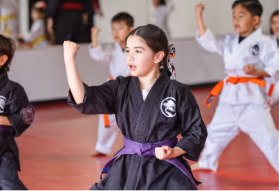 victorious tournament students pose for a picture with their gold and silver tournament medals.