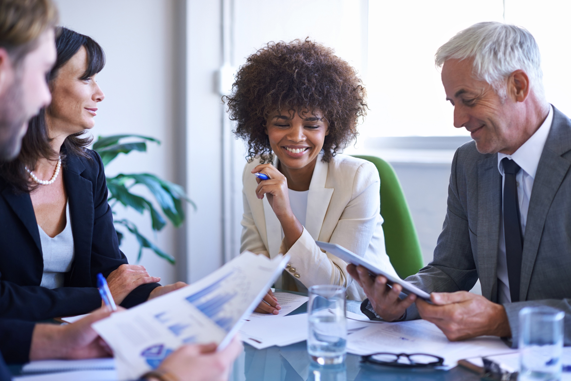 A group of businesspeople having a meeting at a conference table