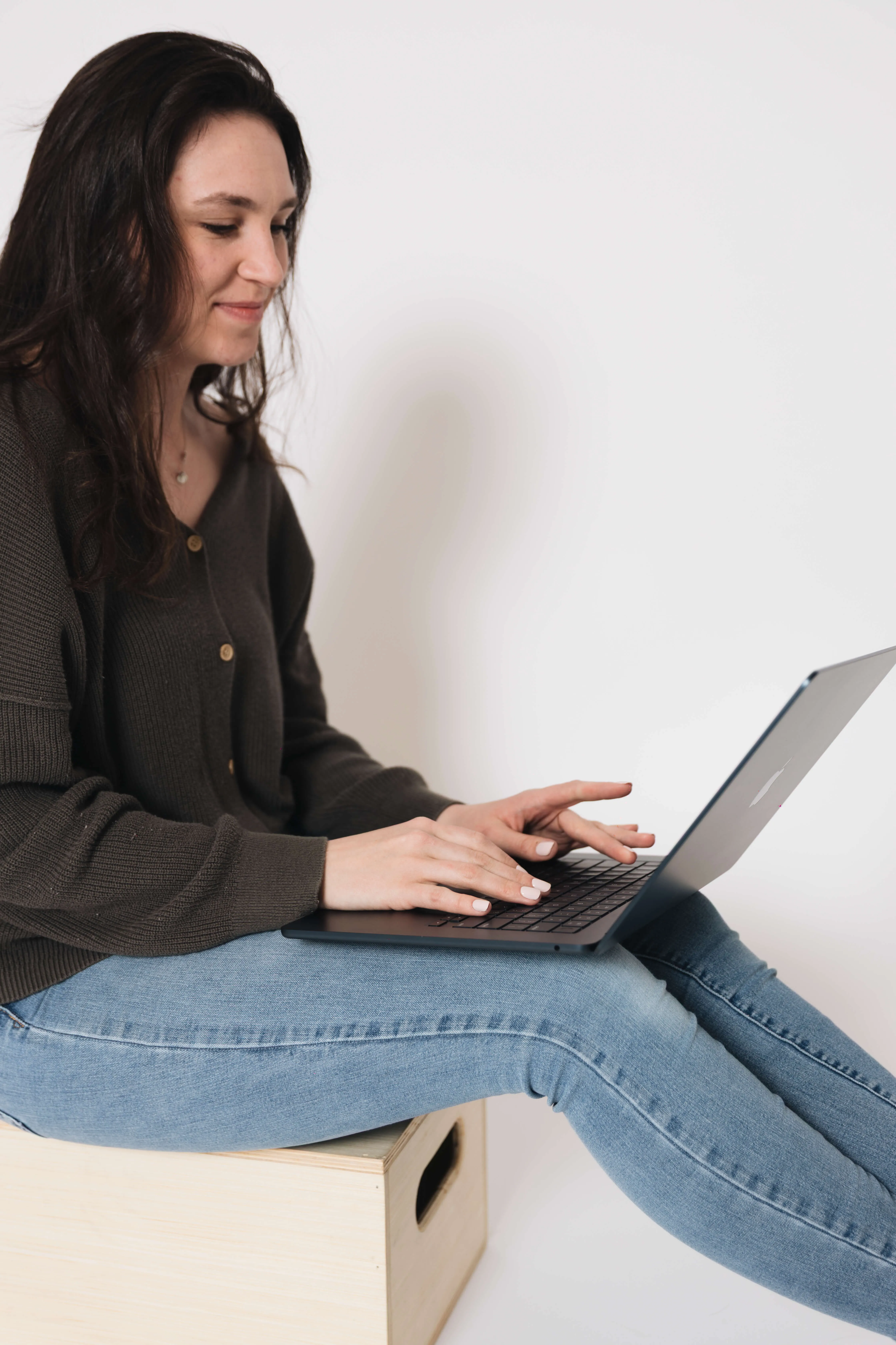 Virtual bookkeeper workspace with laptop and coffee, providing organized bookkeeping services for small business owners.