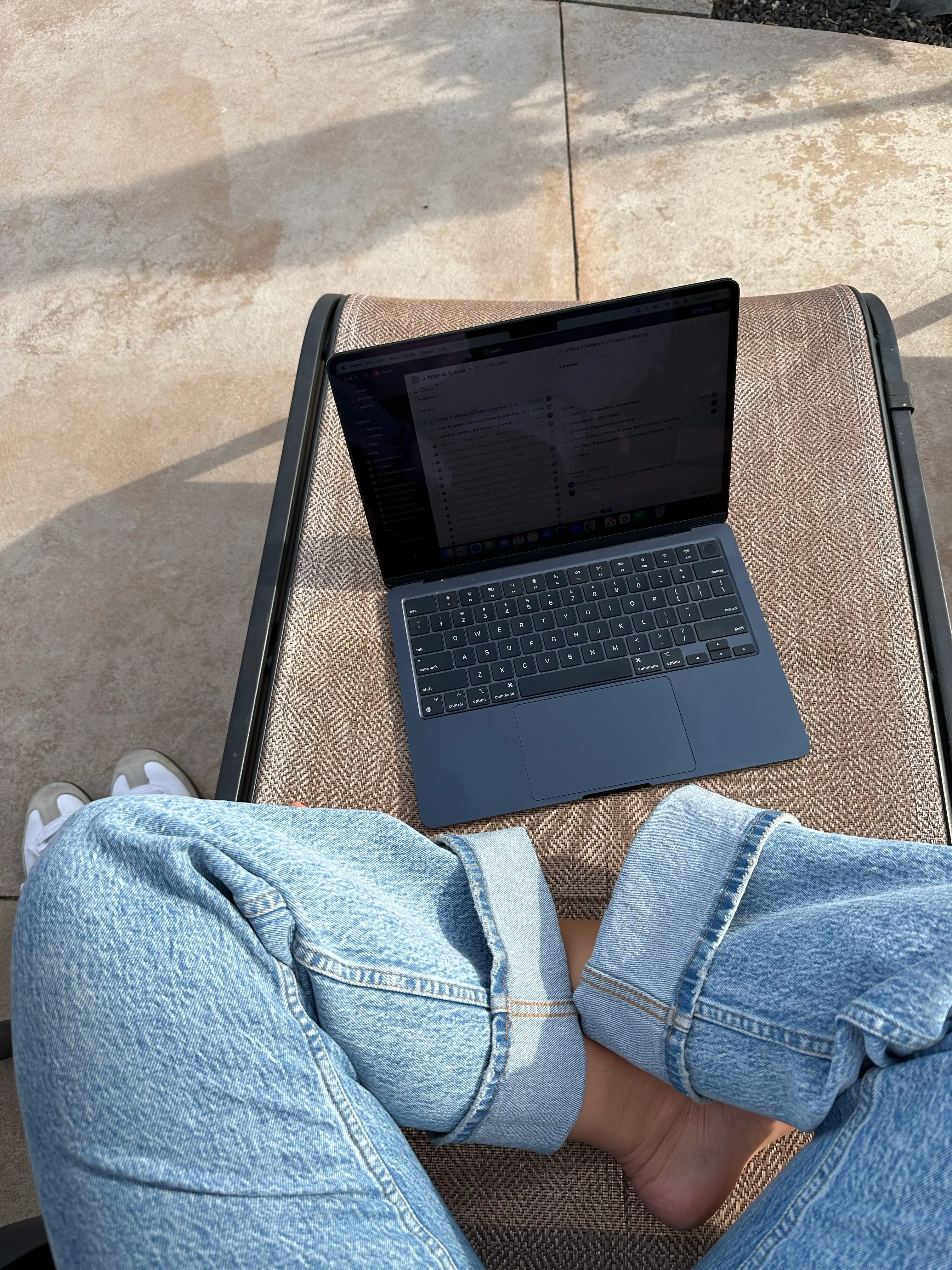 Bookkeeper sitting in front of their laptop planning their client's monthly support and reports.