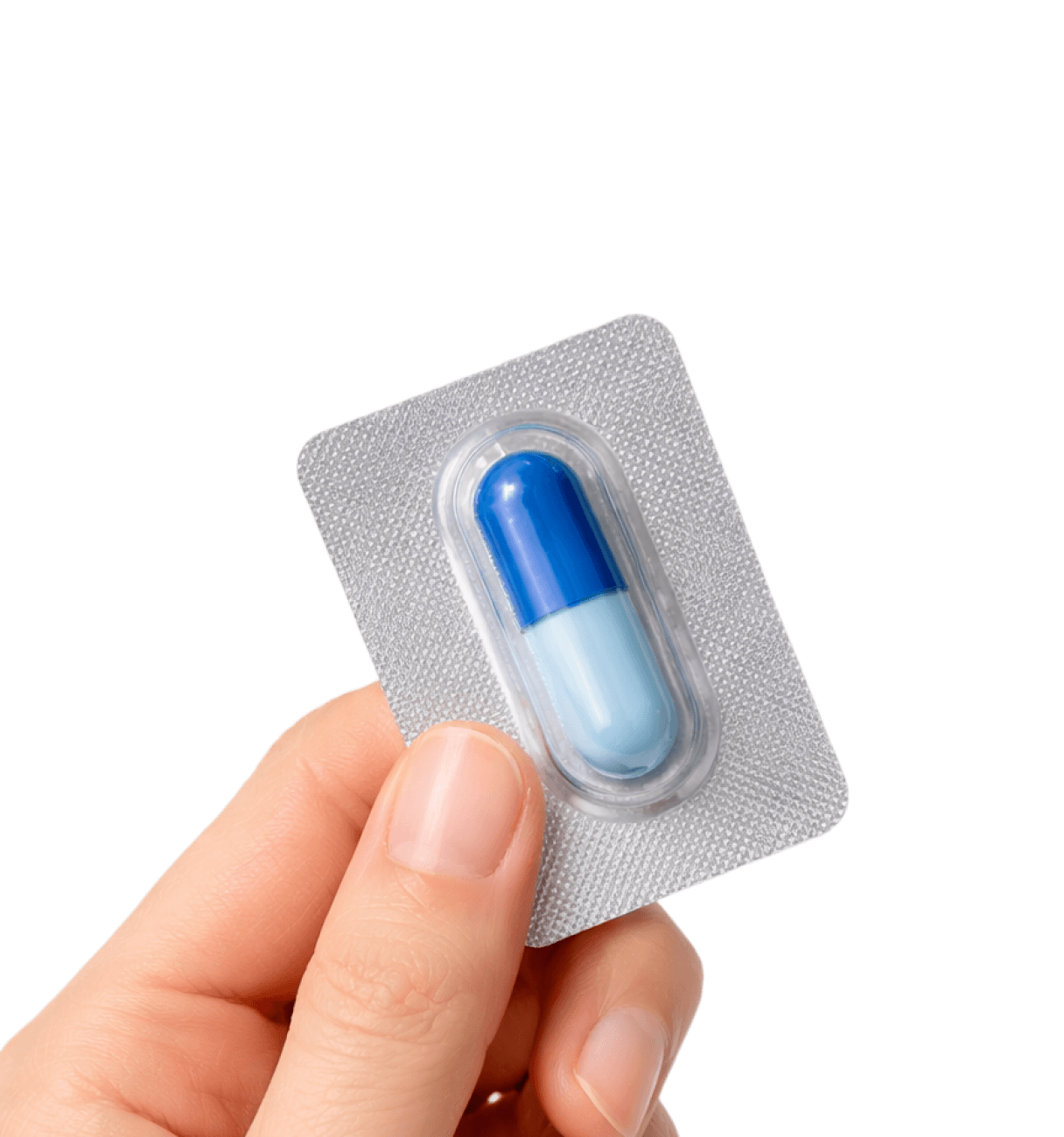 Hand holding a single blue and light blue capsule pill in a silver blister pack.