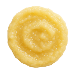 Smooth, pale yellow apple puree swirled in a creamy circle, highlighting its soft texture for dog nutrition