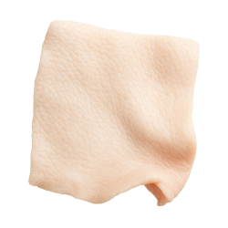 Pale pink pork skin square with a slightly wrinkled, textured surface, ideal as a natural dog treat ingredient