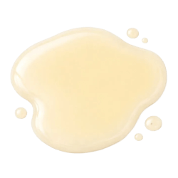Pale yellow lamb oil liquid with a glossy, smooth texture and small droplets on a white background