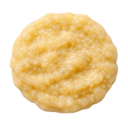 Creamy yellow banana puree with a smooth, slightly chunky texture, perfect for healthy dog treat recipes